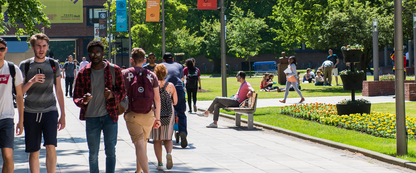 Postgraduate students exploring the campus gardens